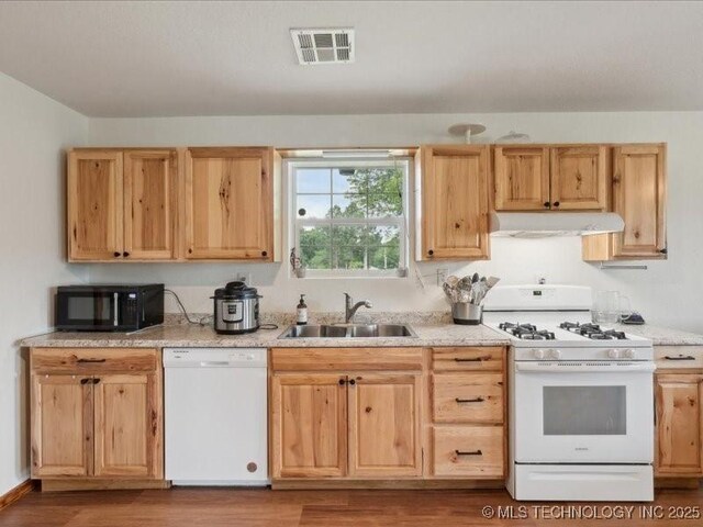 25301 E 330th Rd, Chelsea, OK 74016 - kitchen with white appliances, a sink, under cabinet range hood, and light brown cabinets