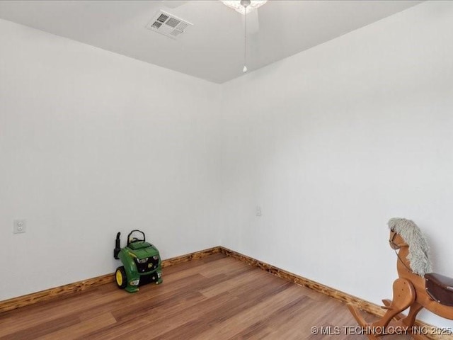 25301 E 330th Rd, Chelsea, OK 74016 - empty room featuring wood finished floors, baseboards, and ceiling fan