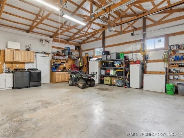 25301 E 330th Rd, Chelsea, OK 74016 - garage featuring a workshop area, independent washer and dryer, and fridge