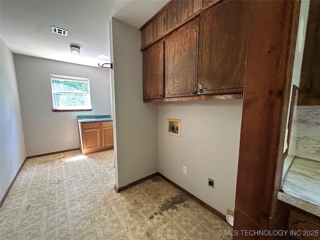 9871 E Windy Ln, Lane, OK 74555 - washroom featuring cabinet space, washer hookup, hookup for an electric dryer, baseboards, and light floors