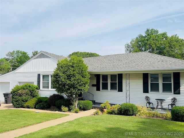 3600 Harvey Rd, Bartlesville, OK 74006 - view of front of home with a front lawn, a garage, roof with shingles, and board and batten siding