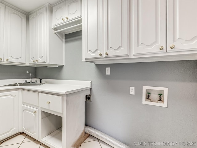406 Sequoyah Trl, Norman, OK 73071 - laundry room featuring cabinet space, electric dryer hookup, washer hookup, and light tile patterned floors