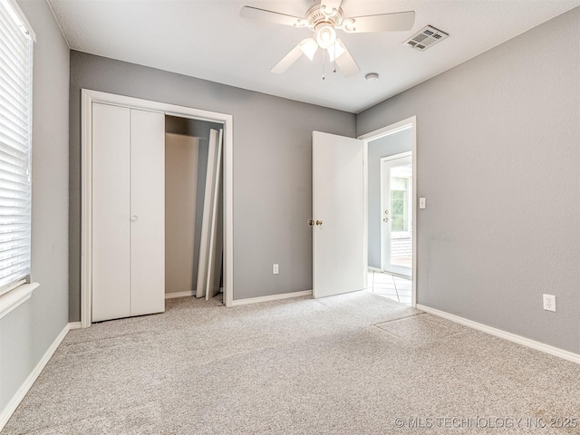 406 Sequoyah Trl, Norman, OK 73071 - unfurnished bedroom with carpet floors, multiple windows, and a ceiling fan