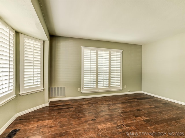406 Sequoyah Trl, Norman, OK 73071 - spare room with wood finished floors, plenty of natural light, and baseboards
