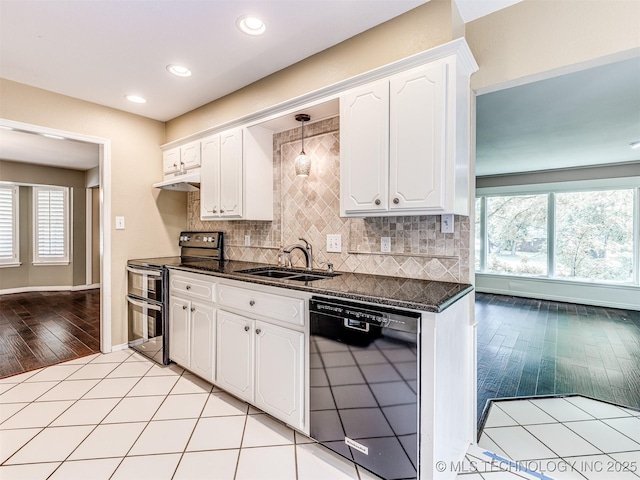 406 Sequoyah Trl, Norman, OK 73071 - kitchen featuring range with two ovens, black dishwasher, a sink, healthy amount of natural light, and recessed lighting