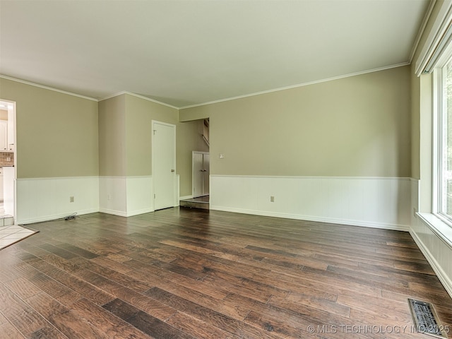406 Sequoyah Trl, Norman, OK 73071 - empty room with hardwood / wood-style floors, healthy amount of natural light, a wainscoted wall, and crown molding