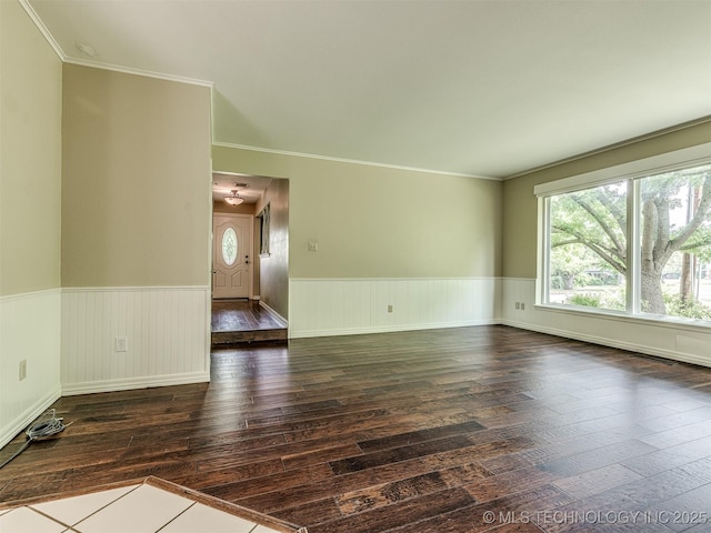 406 Sequoyah Trl, Norman, OK 73071 - spare room featuring dark wood finished floors, a wainscoted wall, and crown molding