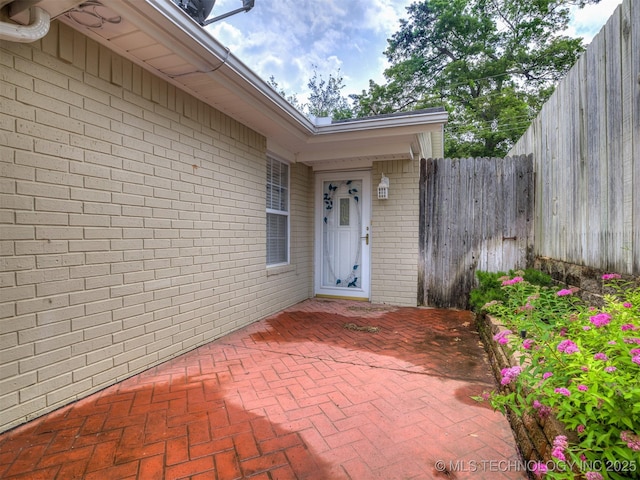 406 Sequoyah Trl, Norman, OK 73071 - property entrance featuring brick siding and a patio area