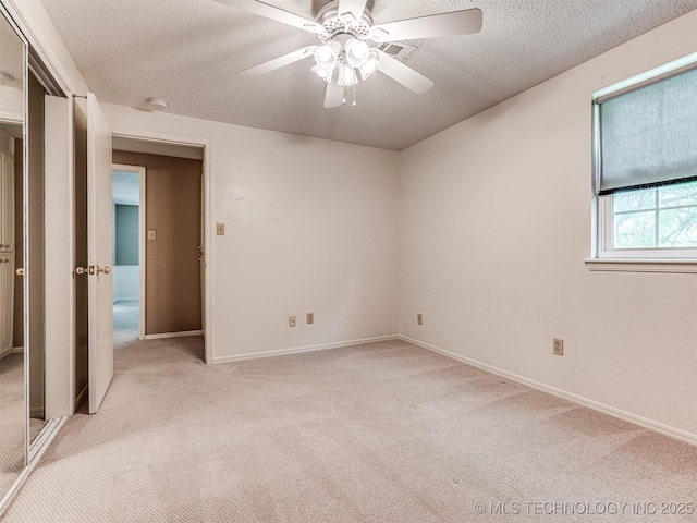 406 Sequoyah Trl, Norman, OK 73071 - unfurnished room featuring light colored carpet, a textured ceiling, ceiling fan, a smoke detector, and baseboards