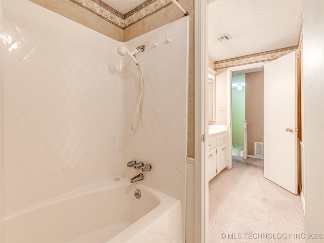 406 Sequoyah Trl, Norman, OK 73071 - full bathroom with bathing tub / shower combination, vanity, a textured ceiling, and baseboards