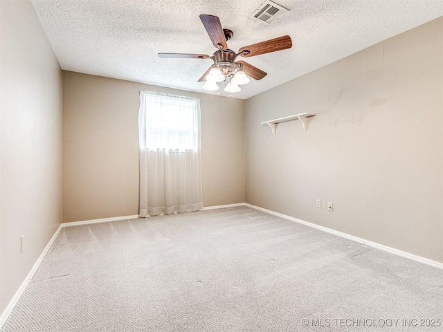 406 Sequoyah Trl, Norman, OK 73071 - spare room featuring ceiling fan, carpet flooring, a textured ceiling, and baseboards