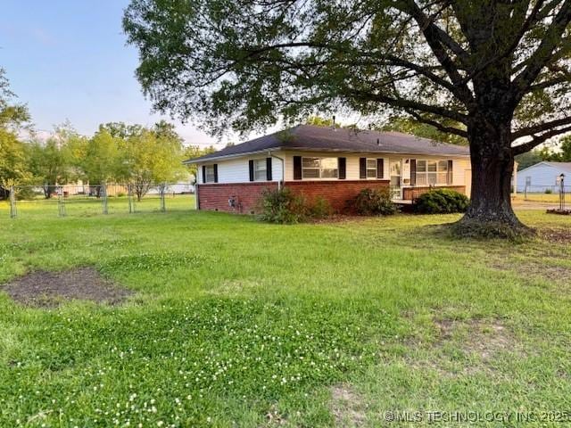 1714 E 11th St, Okmulgee, OK 74447 - rear view of property with brick siding