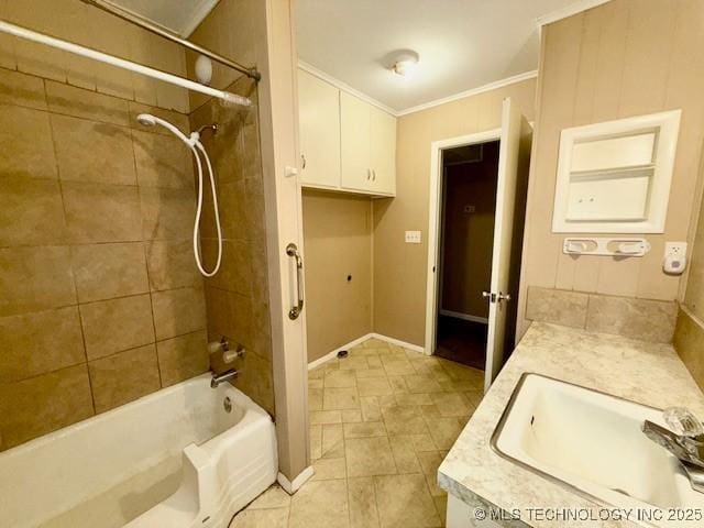 1714 E 11th St, Okmulgee, OK 74447 - bathroom featuring vanity, ornamental molding, shower / bathtub combination, and baseboards