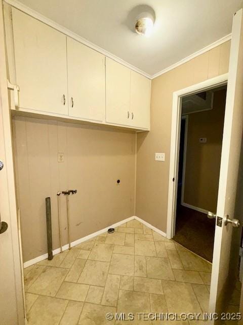 1714 E 11th St, Okmulgee, OK 74447 - washroom with cabinet space, ornamental molding, and baseboards