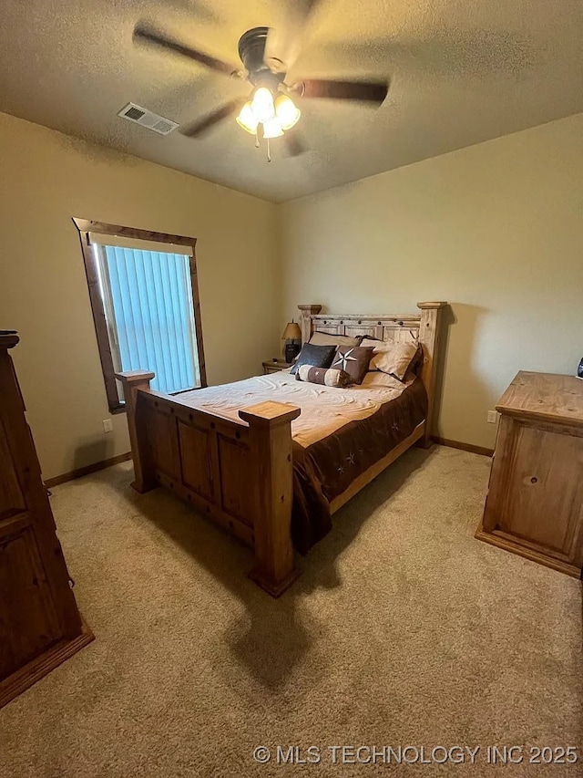 17 Zachary Taylor, Durant, OK 74701 - bedroom with a textured ceiling, light carpet, baseboards, and ceiling fan