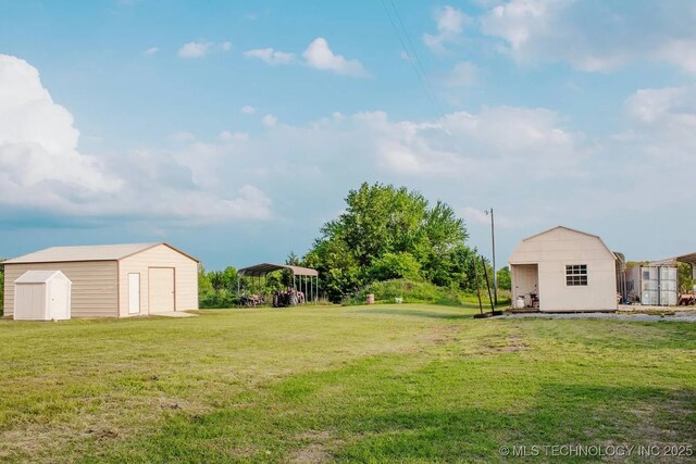 17 Zachary Taylor, Durant, OK 74701 - view of grassy yard with a detached garage and a detached carport