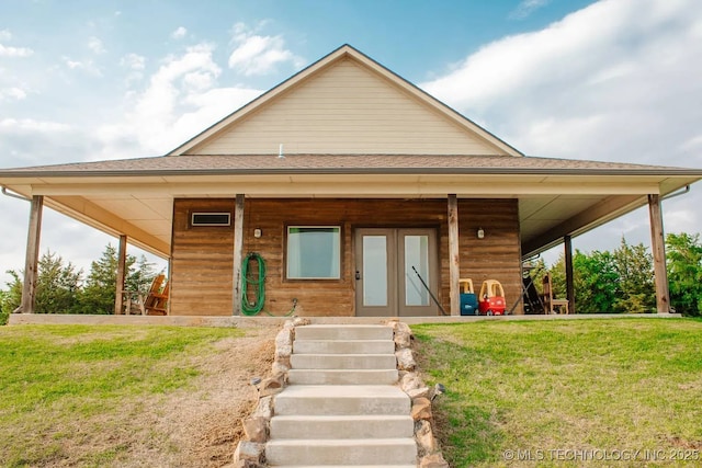 17 Zachary Taylor, Durant, OK 74701 - view of front of property with french doors, a front yard, and a shingled roof
