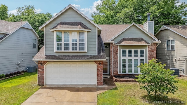 9306 S 94th E Ave, Tulsa, OK 74133 - view of front of property featuring a shingled roof, brick siding, driveway, a front yard, and an attached garage