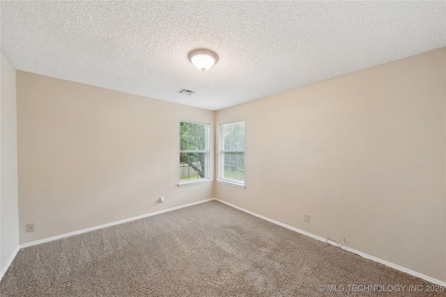 9306 S 94th E Ave, Tulsa, OK 74133 - carpeted spare room featuring a textured ceiling and baseboards