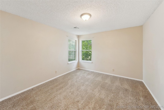 9306 S 94th E Ave, Tulsa, OK 74133 - spare room with a textured ceiling, carpet flooring, and baseboards