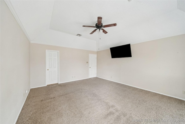 9306 S 94th E Ave, Tulsa, OK 74133 - spare room with carpet, ceiling fan, baseboards, ornamental molding, and a tray ceiling