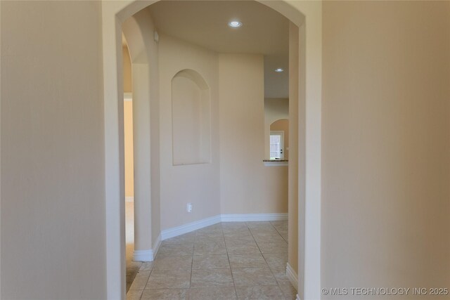 1425 Switchgrass, Edmond, OK 73013 - corridor with recessed lighting, arched walkways, and baseboards