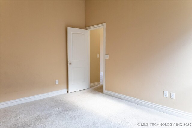 1425 Switchgrass, Edmond, OK 73013 - spare room with carpet flooring and baseboards