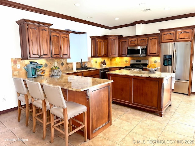2013 State Highway 9a, Eufaula, OK 74432 - kitchen featuring stainless steel appliances, a sink, light stone counters, a peninsula, and crown molding