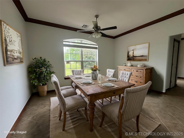 2013 State Highway 9a, Eufaula, OK 74432 - dining space with crown molding, ceiling fan, dark tile patterned flooring, and baseboards