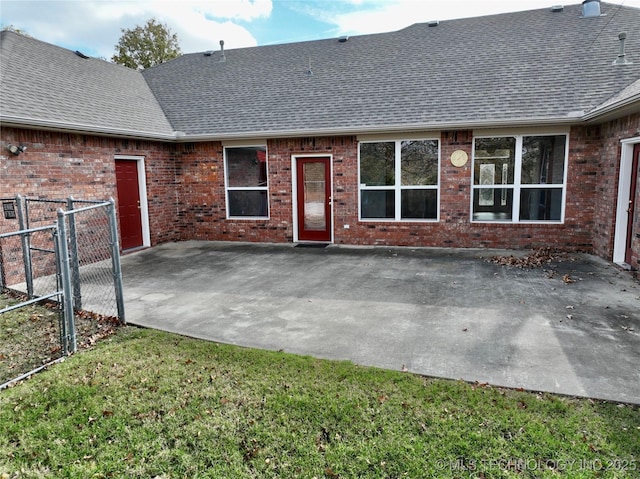 2013 State Highway 9a, Eufaula, OK 74432 - rear view of property with a shingled roof, brick siding, a patio area, and a gate