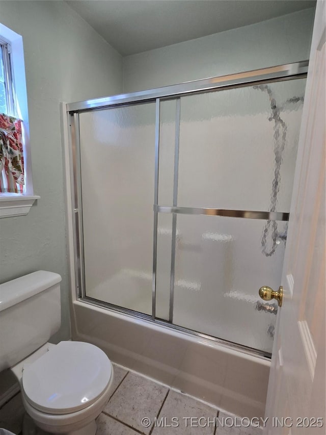 110534 S 4183rd Rd, Checotah, OK 74426 - bathroom featuring combined bath / shower with glass door, toilet, and tile patterned flooring