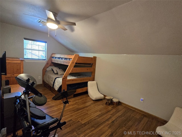 110534 S 4183rd Rd, Checotah, OK 74426 - bedroom featuring wood finished floors, vaulted ceiling, baseboards, and a ceiling fan