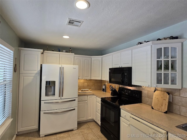 110534 S 4183rd Rd, Checotah, OK 74426 - kitchen featuring black appliances, light countertops, white cabinets, backsplash, and recessed lighting