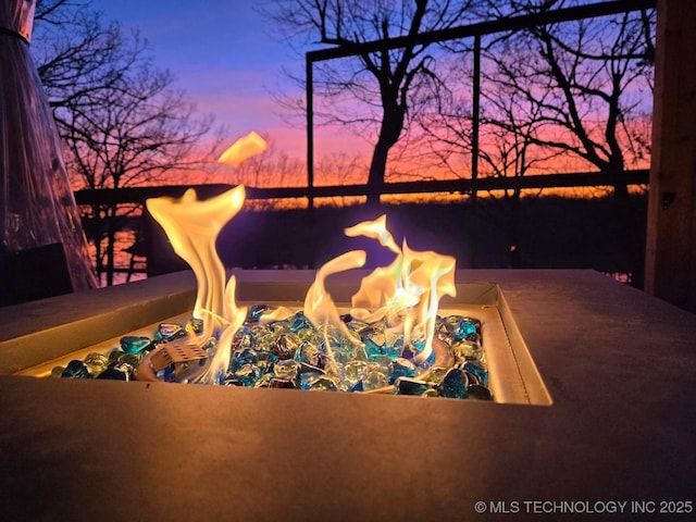 110534 S 4183rd Rd, Checotah, OK 74426 - patio terrace at dusk with an outdoor fire pit