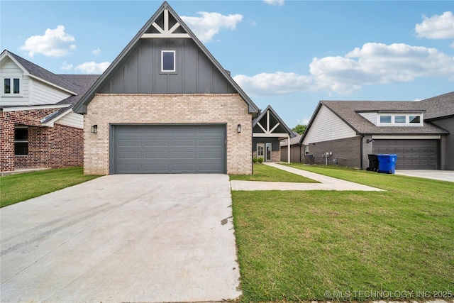 2504 W Birmingham St, Broken Arrow, OK 74011 - view of front of home with board and batten siding, brick siding, a front yard, concrete driveway, and central AC