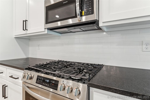 2504 W Birmingham St, Broken Arrow, OK 74011 - kitchen with stainless steel appliances, decorative backsplash, white cabinetry, and dark stone counters