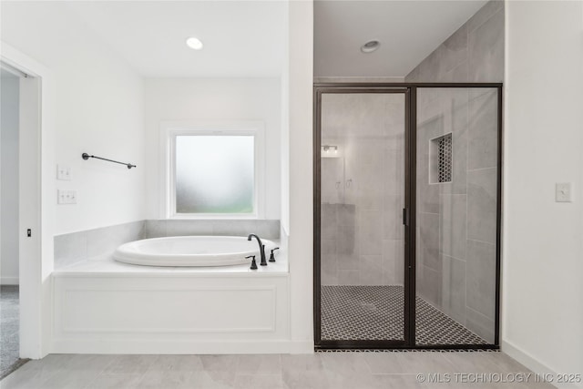 2504 W Birmingham St, Broken Arrow, OK 74011 - bathroom featuring a garden tub, a stall shower, tile patterned floors, and baseboards