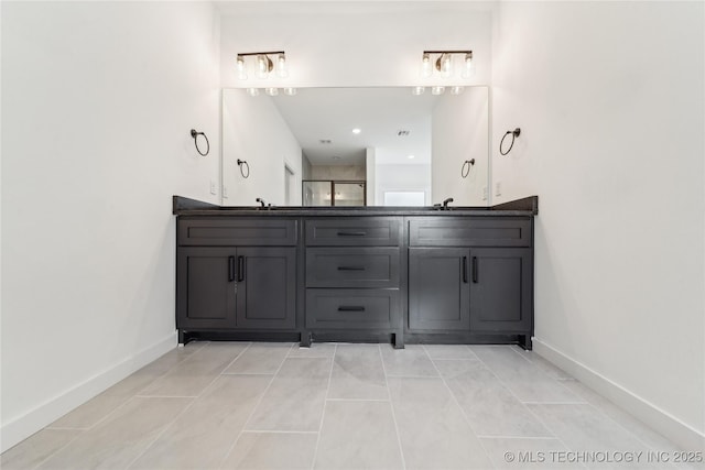 2504 W Birmingham St, Broken Arrow, OK 74011 - full bathroom featuring double vanity, baseboards, and tile patterned flooring