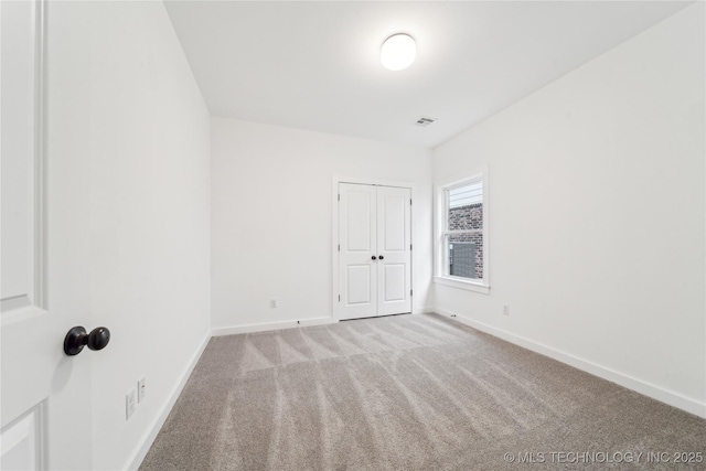 2504 W Birmingham St, Broken Arrow, OK 74011 - unfurnished bedroom with carpet, baseboards, and a closet