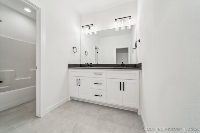 2504 W Birmingham St, Broken Arrow, OK 74011 - bathroom with double vanity and baseboards