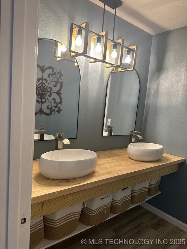 166 N Spruce Ave, Bartlesville, OK 74006 - bathroom with wood finished floors and double vanity