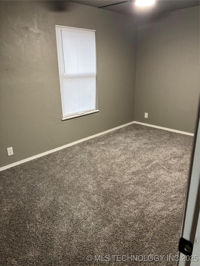 413 E 8th St, Cushing, OK 74023 - spare room featuring carpet flooring and baseboards