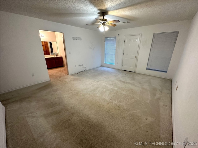 108 NW Division St, Red Oak, OK 74563 - empty room with a ceiling fan, light colored carpet, and a textured ceiling