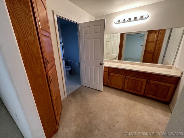 108 NW Division St, Red Oak, OK 74563 - bathroom featuring vanity, toilet, and carpet flooring