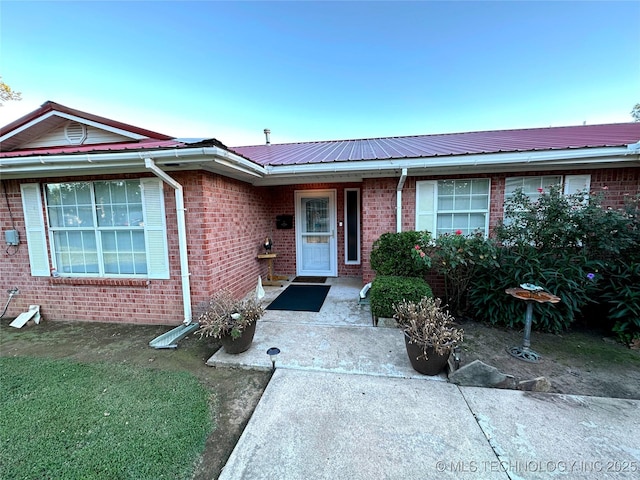 108 NW Division St, Red Oak, OK 74563 - entrance to property with metal roof and brick siding