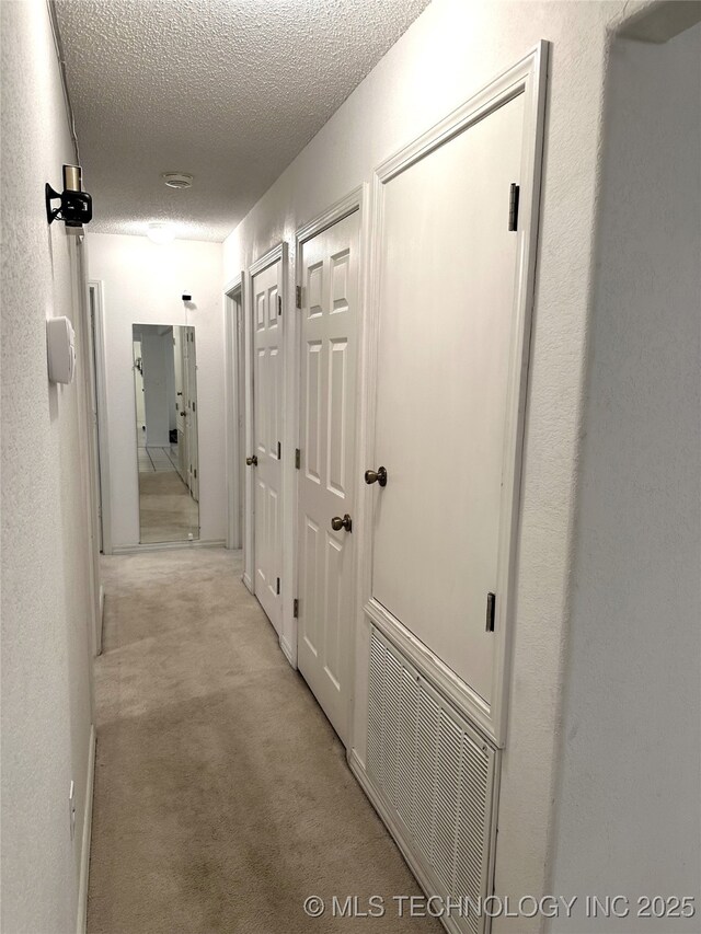 108 NW Division St, Red Oak, OK 74563 - hall with a textured ceiling and light colored carpet