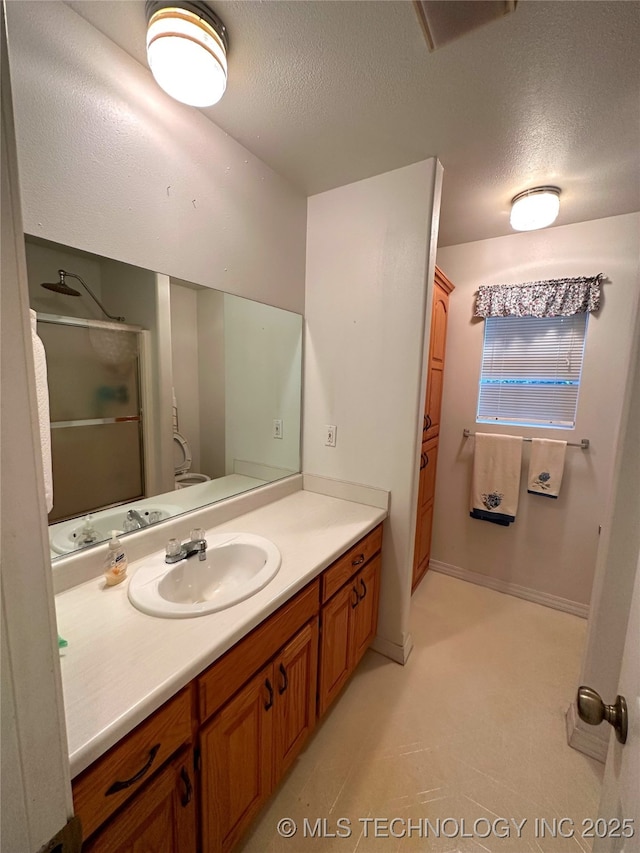 108 NW Division St, Red Oak, OK 74563 - full bathroom with a textured ceiling, vanity, and a shower stall