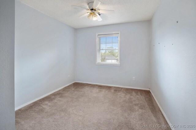 901 Christy, Calera, OK 74730 - carpeted spare room with a ceiling fan, a textured ceiling, and baseboards