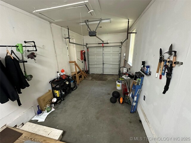 661 12th NW, Ardmore, OK 73401 - garage featuring a garage door opener