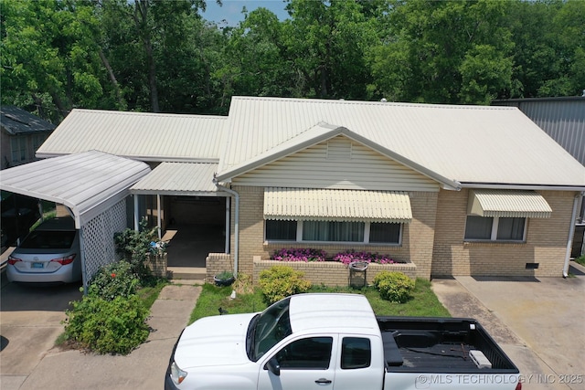 661 12th NW, Ardmore, OK 73401 - view of front of home with brick siding and metal roof